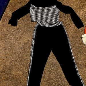 A women’s two piece black and white outfit crop top